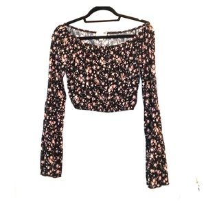 Crop top with long flared sleeves.